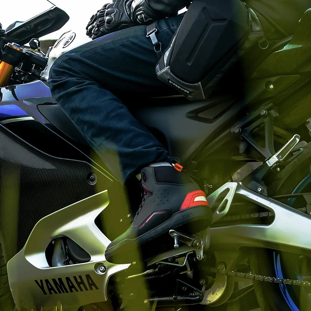 Clan Torque riding shoe photographed around a motorcycle