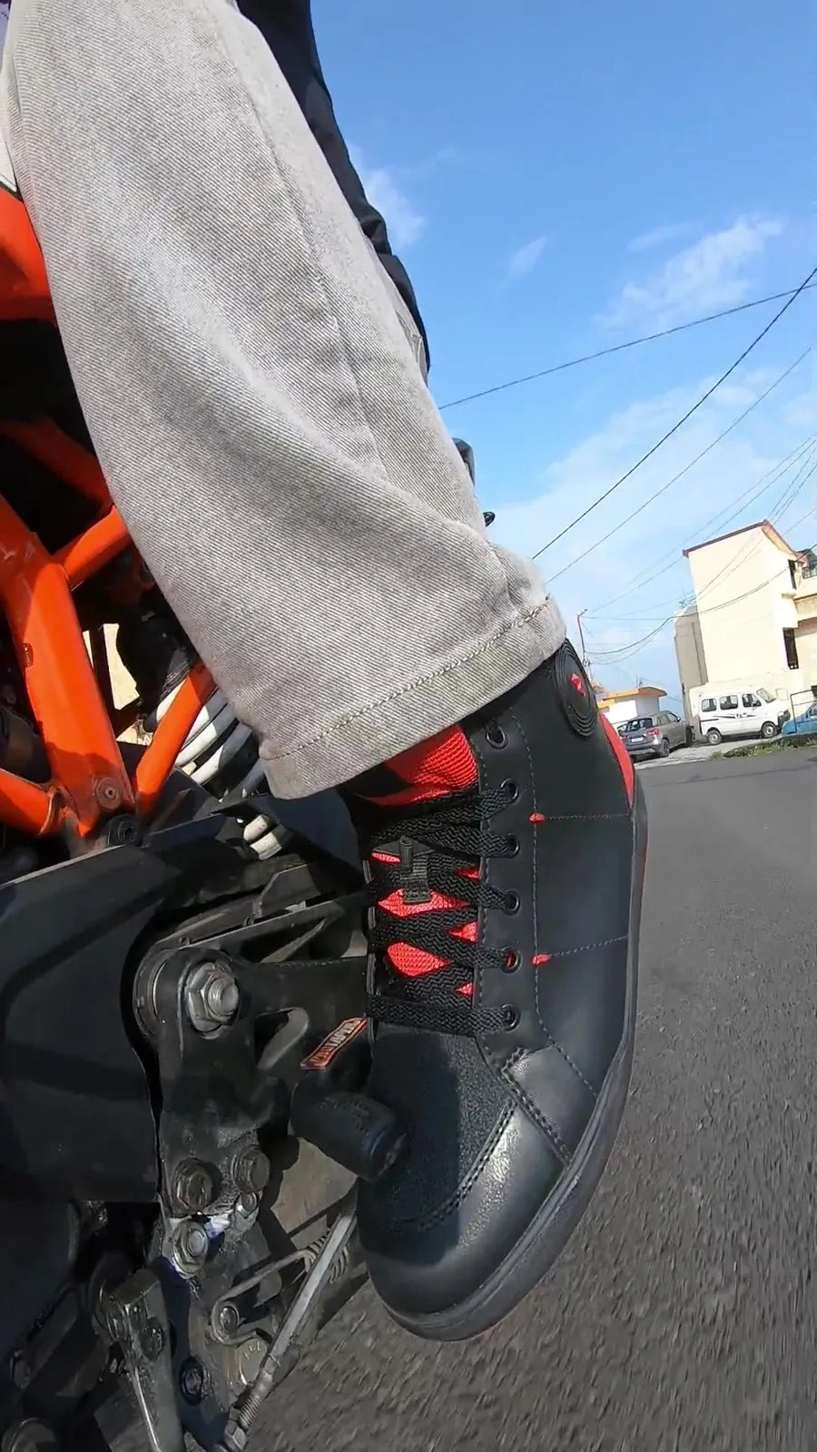 Clan Scout riding shoe on a motorcycle foot control